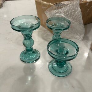 Set of 3 blue glass candle holders.